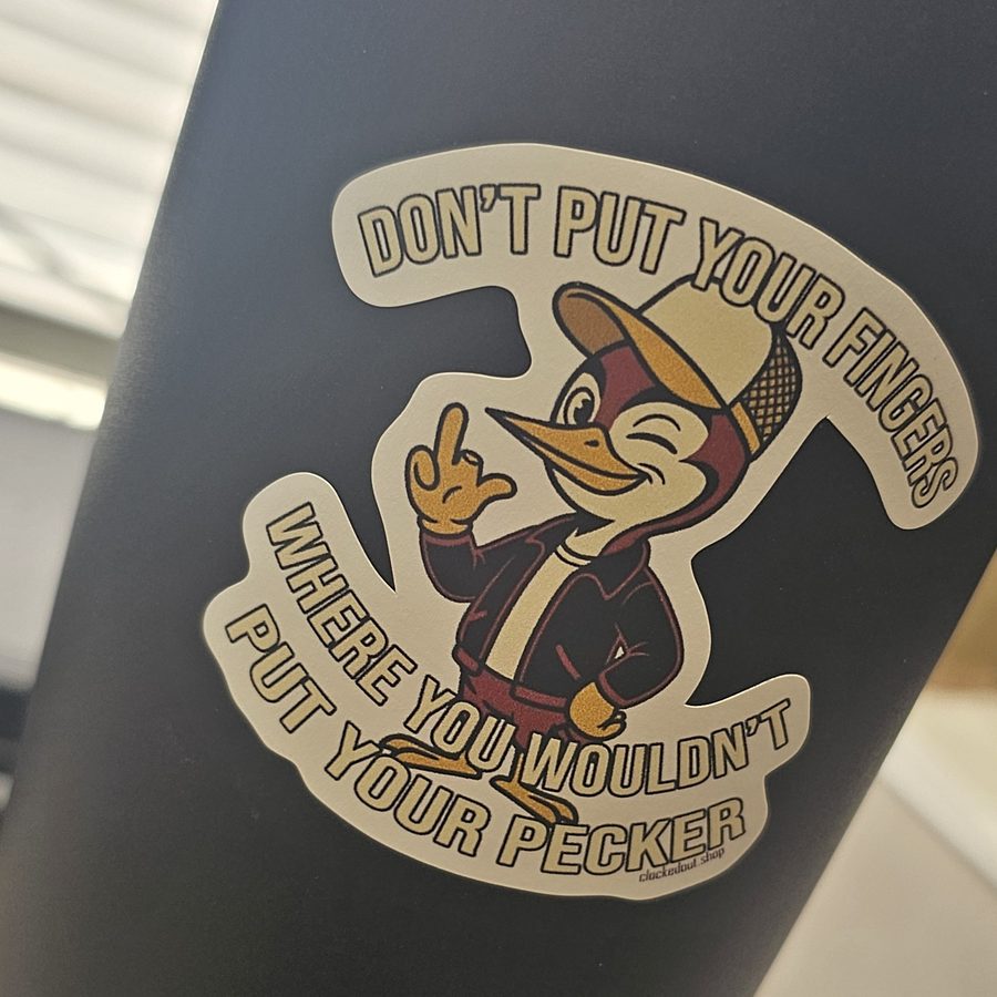 Clocked Out sticker on a steel tumbler